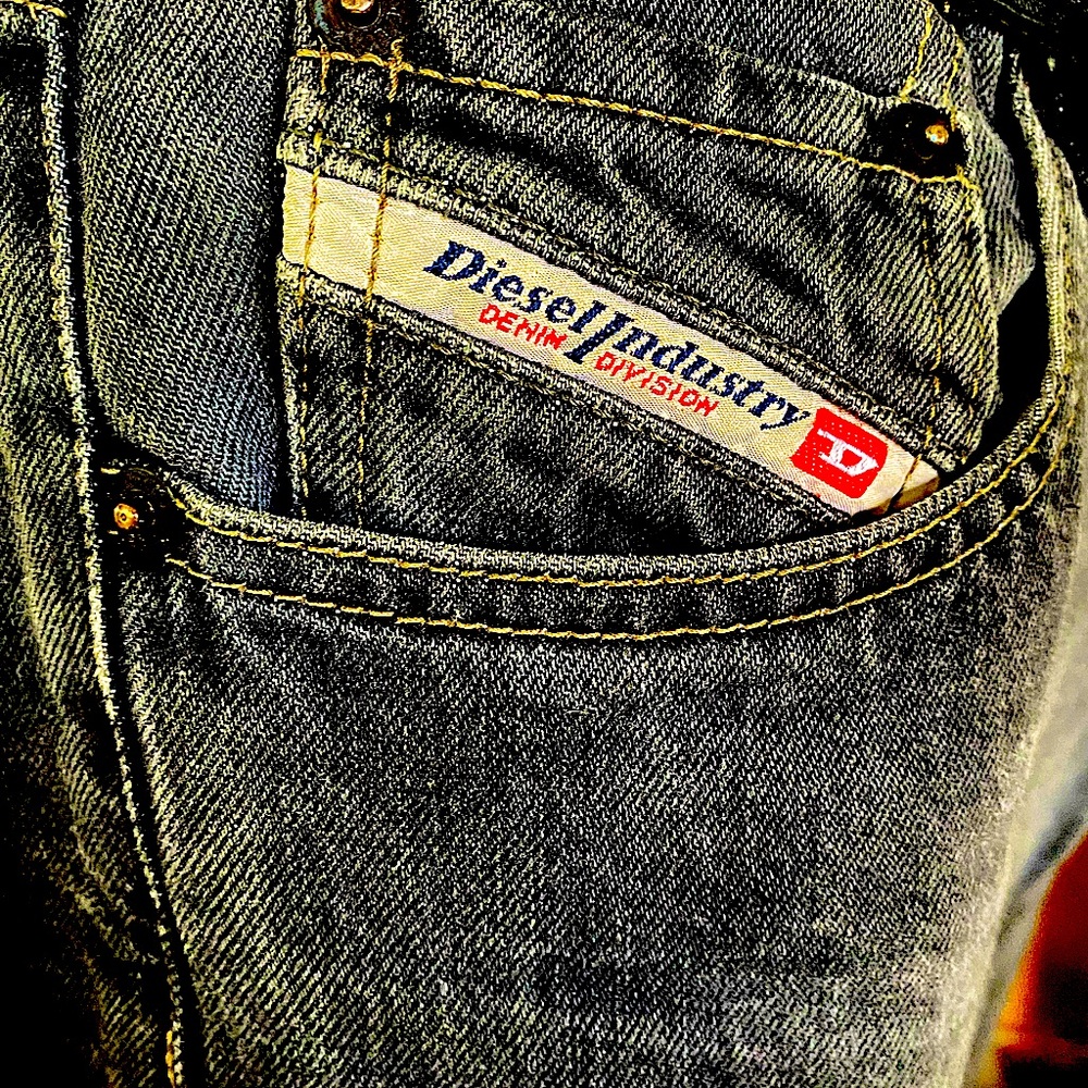 Diesel Black Jeans. Faded and broken in. Slight fraying on bottom of pants.